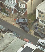 Philadelphia police are searching for three men who they say stole a car at gunpoint and then crashed it into a home in West Philadelphia.
Mandatory Credit:	KYW via CNN Newsource