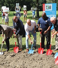 Richmond officials, including Mayor Levar M. Stoney, celebrate the Fall Line Trail groundbreaking Aug. 28 at Bryan Park, while protesters express opposition to the planned route through the historic park. The 43-mile trail will connect Ashland to Petersburg.
