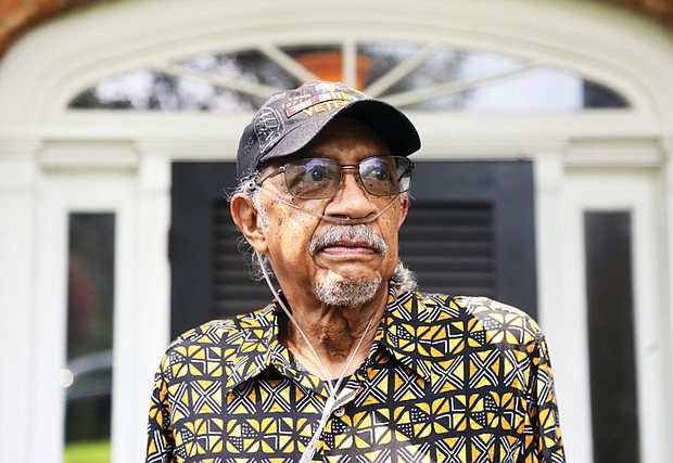 Ed Coleman, a Long COVID survivor, stands in front of the Henrico home he shares with his wife of 22 years, Charlene Warner Coleman.