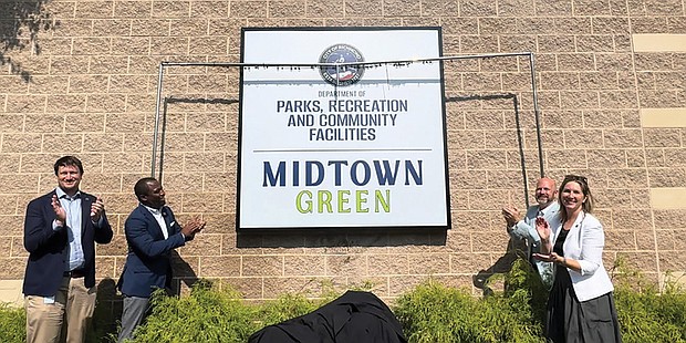 City of Richmond Chief Administrative Officer Lincoln Saunders, Mayor Levar M. Stoney,
Parks and Recreation Director Chris Frelke and Councilwoman Katherine Jordan, 2nd District,
unveil a new sign at the former Bon Secours Training Center, now Midtown Green and head-
quarters for the City Department of Parks, Recreation and Community Facilities. The space,
formerly used by the former Washington NFL team for summer training camps, will host public
events, including a football game between Richmond High School for the Arts and John Marshall
High on Sept. 6.