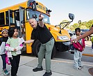 Students at Cardinal Elementary School are greeted by Assistant Principal Baylan Smith. The South Side school reopened this week after damage from a lightning strike on Aug. 26.