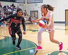 Jenna Nelson of the Richmond Roadrunners drives around DC Cyclones’ Nequoiah Anderson at Henrico High
School on Aug. 31. The Roadrunners fell short but made the playoffs.