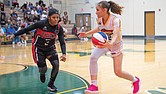 Jenna Nelson of the Richmond Roadrunners drives around DC Cyclones’ Nequoiah Anderson at Henrico High
School on Aug. 31. The Roadrunners fell short but made the playoffs.