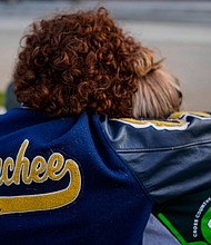 Mourners listen to a speaker during the candlelight vigil.
Mandatory Credit:	Mike Stewart/AP via