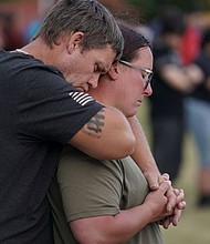 People attend a vigil at Jug Tavern Park following a shooting at Apalachee High School in Winder, Georgia.
Mandatory Credit:	Elijah Nouvelage/Reuters via CNN Newsource