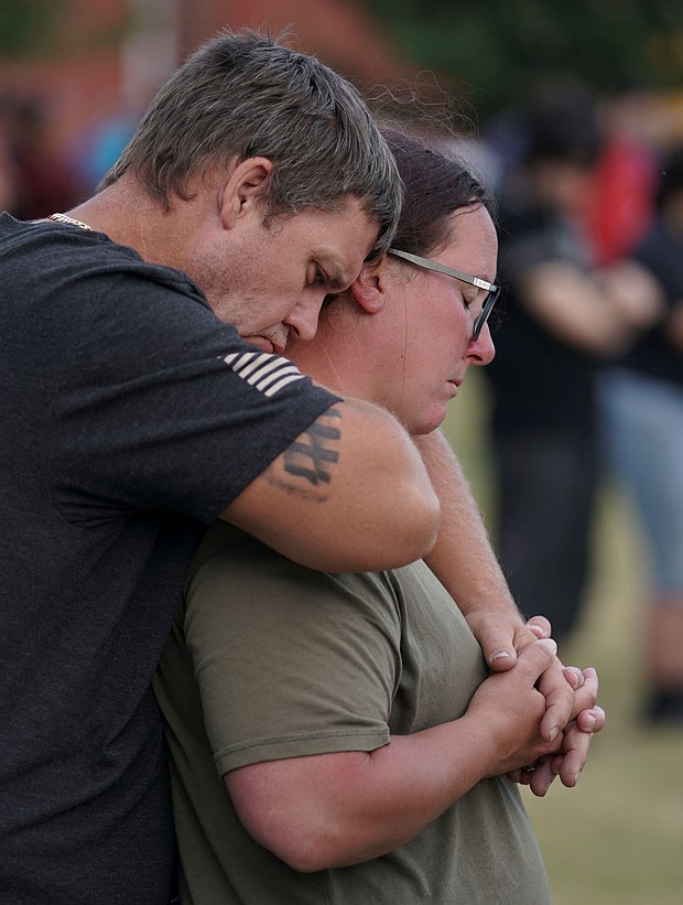 People attend a vigil at Jug Tavern Park following a shooting at Apalachee High School in Winder, Georgia.
Mandatory Credit:	Elijah Nouvelage/Reuters via CNN Newsource