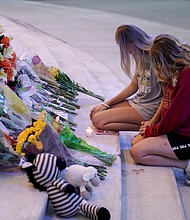 People attend a vigil at Jug Tavern Park following a shooting at Apalachee High School in Winder, Georgia, U.S. September 4.
Mandatory Credit:	Elijah Nouvelage/Reuters via CNN Newsource