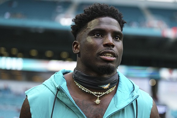 The Miami-Dade Police Department placed an officer on administrative leave Sunday after Miami Dolphins star Tyreek Hill was detained prior …