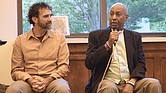 Director of The Humanization Project and former prisoner Taj Mahon-Haft looks on as Pastor Rodney Hunter speaks during a panel discussion as part of the opening of the “Virginia Needs a Second Chance” exhibition at the Richmond Public Library last Friday evening.