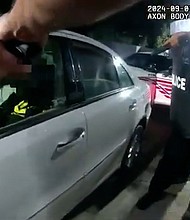 Peaceful protests over the fatal police shooting of Justin Robinson in Washington, DC, turned violent after protesters threw bottles and rocks at police officers, leading to arrests, according to authorities.
Mandatory Credit:	Metropolitan Police Department of the District of Columbia via CNN Newsource