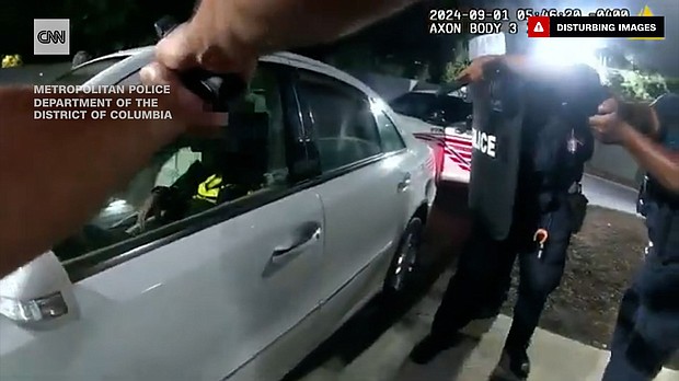 Peaceful protests over the fatal police shooting of Justin Robinson in Washington, DC, turned violent after protesters threw bottles and rocks at police officers, leading to arrests, according to authorities.
Mandatory Credit:	Metropolitan Police Department of the District of Columbia via CNN Newsource