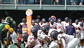 Virginia State lines up against Norfolk State’s defense in a high stakes showdown. Despite a strong effort, the Trojans narrowly fell 28-23 in a thrilling contest.