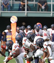 Virginia State lines up against Norfolk State’s defense in a high stakes showdown. Despite a strong effort, the Trojans narrowly fell 28-23 in a thrilling contest.