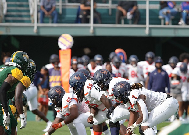 Virginia State lines up against Norfolk State’s defense in a high stakes showdown. Despite a strong effort, the Trojans narrowly fell 28-23 in a thrilling contest.