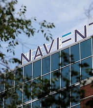 Signage is seen on the offices of Navient in Wilmington, Delaware, in June 2021.
Mandatory Credit:	Andrew Kelly/Reuters via CNN Newsource