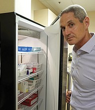 Childhood vaccines are stored in temperature-controlled refrigerators at Dr. Eric Ball’s practice in Orange County, Calif.