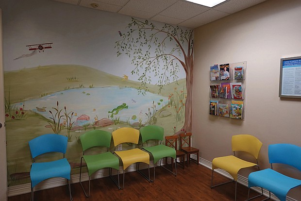 Murals adorn the walls of the waiting room at Dr. Ball’s pediatrics practice.
