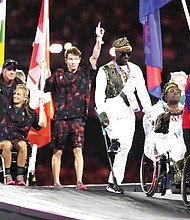 Athletes from different delegations parade Sept. 8 during the closing ceremony of the 2024 Paralympics in Paris.