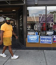 Signs of the times at Unlimited Performance Barber Shop in North Side on Aug. 24.