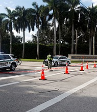 Law enforcement vehicles are parked after reports of shots fired outside Republican presidential nominee and former U.S. President Donald Trump's Trump International Golf Course in West Palm Beach, Florida, U.S. September 15, 2024.
Mandatory Credit:	Marco Bello/Reuters via CNN Newsource
