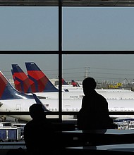 Delta Air Lines planes sit at gates at Salt Lake City International Airport in a 2020 file photo.
Mandatory Credit:	George Frey/Bloomberg/Getty Images/FILE via CNN Newsource