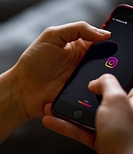 Instagram, pictured here in 2021 on a smartphone in Berlin, is rolling out new safety features for teen users.
Mandatory Credit:	Fabian Sommer/dpa/picture alliance/Getty Images via CNN Newsource