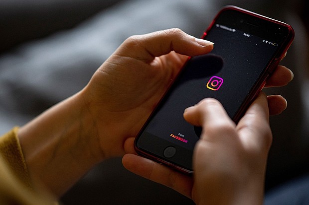 Instagram, pictured here in 2021 on a smartphone in Berlin, is rolling out new safety features for teen users.
Mandatory Credit:	Fabian Sommer/dpa/picture alliance/Getty Images via CNN Newsource