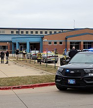 Law enforcement officers work at the scene of a shooting at Perry High School in Perry, Iowa, on January 4, 2024.
Mandatory Credit:	Scott Morgan/Reuters via CNN Newsource