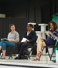 Kenya Gibson speaks at the North Side forum held at Linwood Holton Elementary School, while moderator Grady Hart, right, president of the Rosedale Civic Association, listens. The event drew over 100 residents as Gibson, incumbent Ann-Frances Lambert, and challenger Maria Carra Rose discussed key issues.