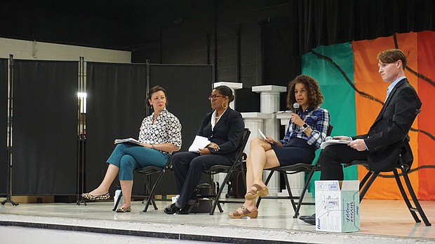 Kenya Gibson speaks at the North Side forum held at Linwood Holton Elementary School, while moderator Grady Hart, right, president of the Rosedale Civic Association, listens. The event drew over 100 residents as Gibson, incumbent Ann-Frances Lambert, and challenger Maria Carra Rose discussed key issues.