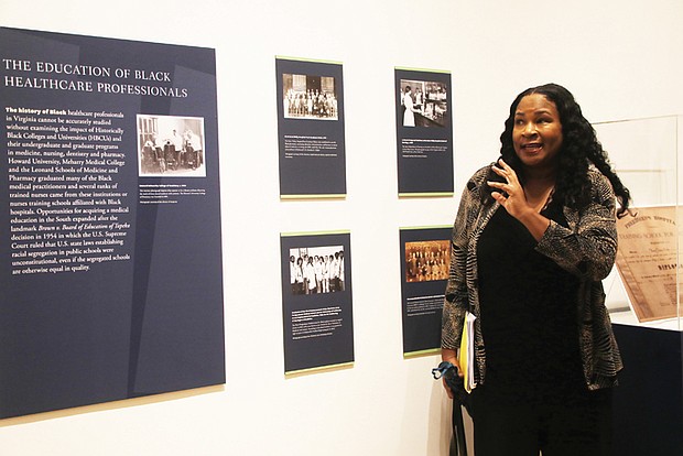 Elvatrice Belsches, guest curator and public historian, gestures toward an exhibit during a preview of “A Prescription
for Change: Black Voices Shaping Healthcare in Virginia” at the Black History Museum & Cultural Center of Virginia.
The exhibition, highlighting Virginia’s Black medical professionals, runs through March 15, 2025.