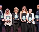 From left: Bobby Wadkins accepting on behalf of himself and his brother, Lanny Wadkins; Joey Richeson, director of student activities at Meadowbrook High School, accepted on behalf of Johnny Grubb; Lyn Williams representing Vic Williams; Lacey Waldrop; Joan Amsler representing Dave Amsler; and former NFL player Ken Oxendine.