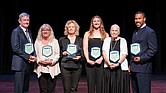 From left: Bobby Wadkins accepting on behalf of himself and his brother, Lanny Wadkins; Joey Richeson, director of student activities at Meadowbrook High School, accepted on behalf of Johnny Grubb; Lyn Williams representing Vic Williams; Lacey Waldrop; Joan Amsler representing Dave Amsler; and former NFL player Ken Oxendine.