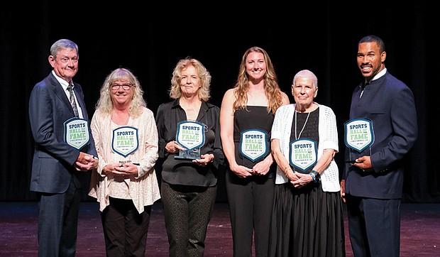 From left: Bobby Wadkins accepting on behalf of himself and his brother, Lanny Wadkins; Joey Richeson, director of student activities at Meadowbrook High School, accepted on behalf of Johnny Grubb; Lyn Williams representing Vic Williams; Lacey Waldrop; Joan Amsler representing Dave Amsler; and former NFL player Ken Oxendine.