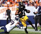 Pittsburgh Steelers quarterback Justin Fields (2) runs against Denver Broncos defensive end Zach Allen (99) on Sunday, Sept. 15, in Denver.