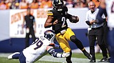 Pittsburgh Steelers quarterback Justin Fields (2) runs against Denver Broncos defensive end Zach Allen (99) on Sunday, Sept. 15, in Denver.