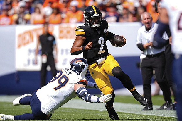 Pittsburgh Steelers quarterback Justin Fields (2) runs against Denver Broncos defensive end Zach Allen (99) on Sunday, Sept. 15, in Denver.