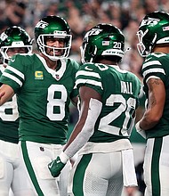 Aaron Rodgers (No. 8) threw two touchdowns on his return to action at MetLife Stadium as the New York Jets beat the New England Patriots.
Mandatory Credit:	Sarah Stier/Getty Images via CNN Newsource