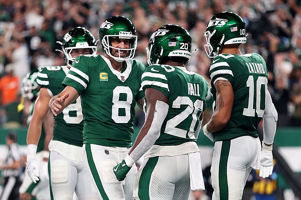 Aaron Rodgers (No. 8) threw two touchdowns on his return to action at MetLife Stadium as the New York Jets beat the New England Patriots.
Mandatory Credit:	Sarah Stier/Getty Images via CNN Newsource