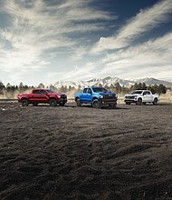 Chevrolet Silverado LT Trail Boss in Radiant Red, Silverado ZR2 in Glacier Blue and Silverado Custom Trail Boss in Summit White.