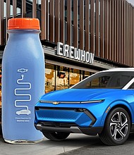 Front 3/4 view of a 2024 Chevy Equinox EV in Riptide Blue with Summit White roof and Equinox EV “Electric Juice” in front of an Erewhon store.