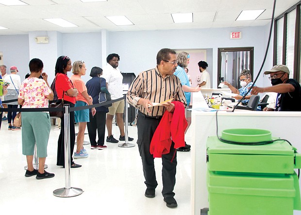 Voters line up at the Richmond Office of Elections on Sept. 20 to cast their ballots for early in-person voting in the 2024 presidential election, along with U.S. Senate, congressional, mayoral, City Council and School Board races. The office is located at 2134 W. Laburnum Ave.