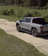 The 2024 GMC Sierra EV undergoes truck obstacle during development testing at General Motors’ Milford Proving Ground.