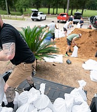 People bag sand in preparation for possible flooding as Tropical Storm Helene heads toward the state's Gulf Coast on September 25 in Tallahassee, Florida.
Mandatory Credit:	Sean Rayford/Getty Images via CNN Newsource