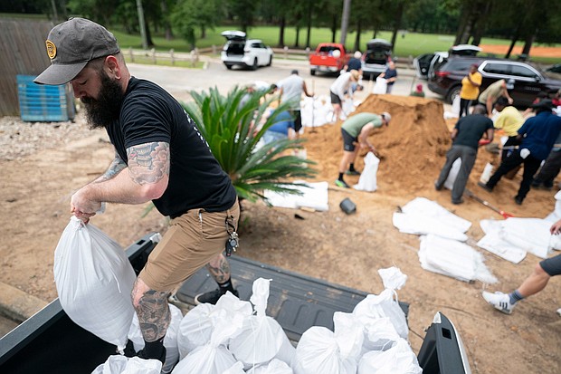 People bag sand in preparation for possible flooding as Tropical Storm Helene heads toward the state's Gulf Coast on September 25 in Tallahassee, Florida.
Mandatory Credit:	Sean Rayford/Getty Images via CNN Newsource