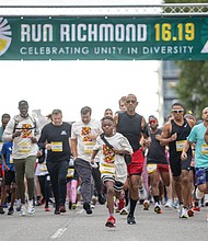 Preston Freeman, 11, center, leads the starting line of the 6.19 race, one of two courses
in the third edition of the Run Richmond 16.19 cultural run-walk event Sept. 21 at
Kanawha Plaza.