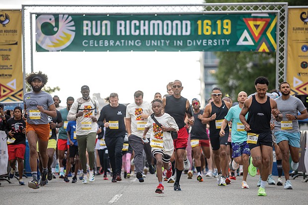 Preston Freeman, 11, center, leads the starting line of the 6.19 race, one of two courses
in the third edition of the Run Richmond 16.19 cultural run-walk event Sept. 21 at
Kanawha Plaza.