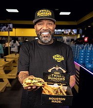 Bun B holding Trill Smash Tacos (photo credit Dylan McEwan)