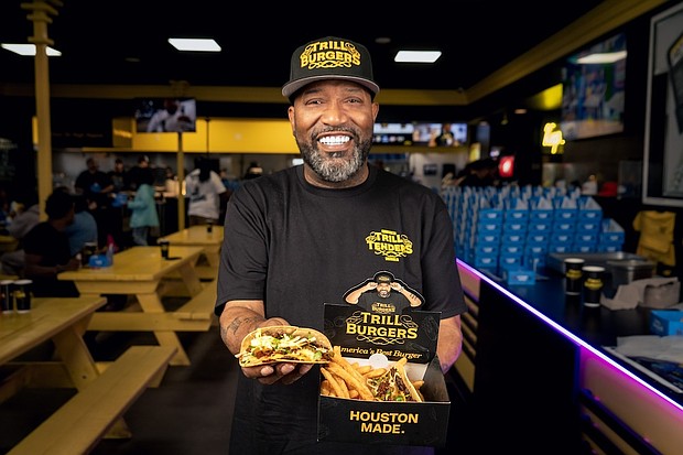 Bun B holding Trill Smash Tacos (photo credit Dylan McEwan)