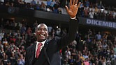 Retired Denver Nuggets center Dikembe Mutombo waves to the crowd as his jersey number is retired by the team during halftime of the Nuggets’ basketball game against the Portland Trail Blazers on Oct. 29, 2016, in Denver.